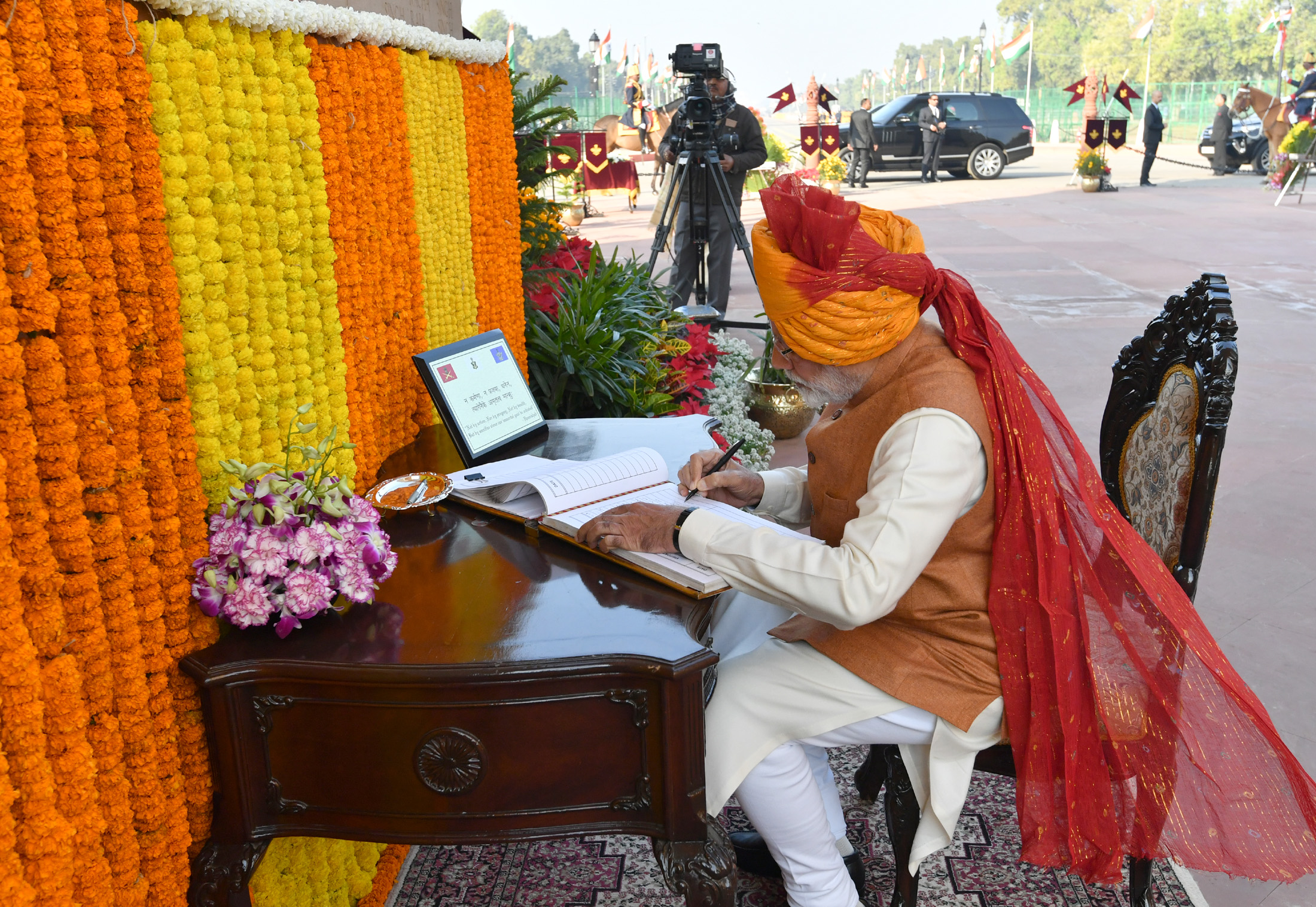 The Prime Minister, Shri Narendra Modi signing the visitor's book at the Amar Jawan Jyoti, India Gate, on the occasion of the 70th Republic Day Parade 2019, in New Delhi on January 26, 2019.