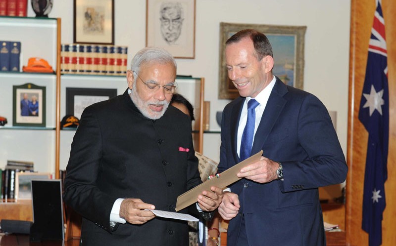 PM presents to Australian PM, a commemorative photo collage dedicated to Mr. John Lang, an Australian with a remarkable Indian connection