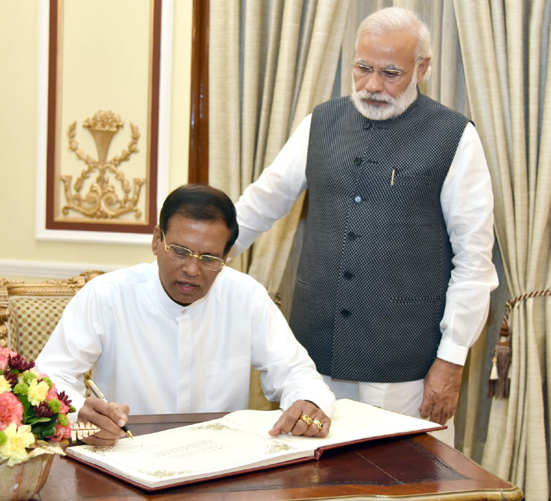 The President of the Democratic Socialist Republic of Sri Lanka, Mr. Maithripala Sirisena signing the visitor's book, in New Delhi on May 13, 2016.
