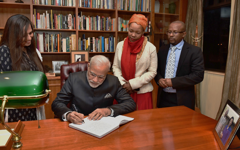 The Prime Minister, Shri Narendra Modi signing the visitor's book at the Nelson Mandela Foundation, in Johannesburg, South Africa on July 08, 2016.