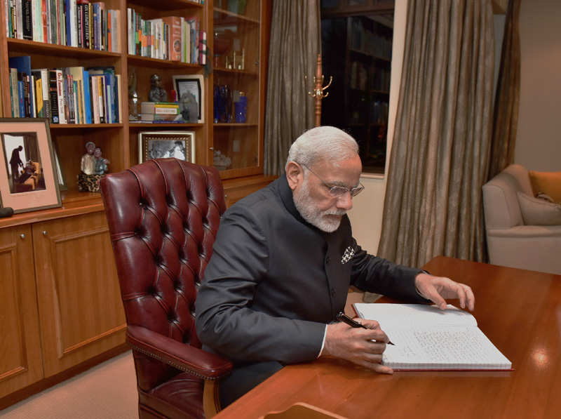 The Prime Minister, Shri Narendra Modi signing the visitor's book at the Constitutional Hill, in Johannesburg, South Africa on July 08, 2016.