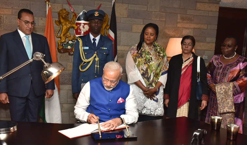 The Prime Minister, Shri Narendra Modi signing the visitors book, at Jomo Kenyatta International Airport, in Nairobi, Kenya on July 10, 2016.
