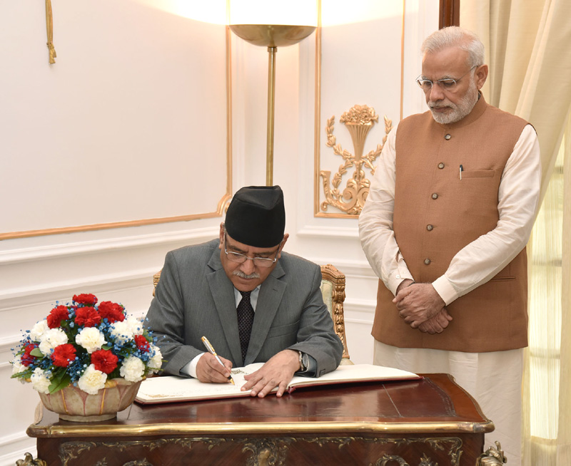 The Prime Minister of Nepal, Mr. Pushpa Kamal Dahal signing the visitor's book, at Hyderabad House, in New Delhi on September 16, 2016.
	The Prime Minister, Shri Narendra Modi is also seen.