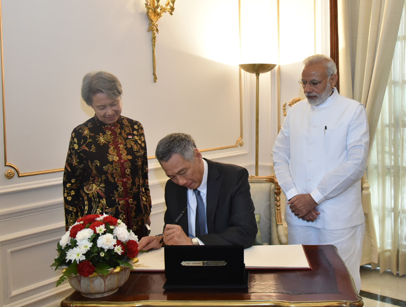 The Prime Minister of Singapore, Mr. Lee Hsien Loong signing the visitors book, at Hyderabad House, in New Delhi on October 04, 2016.