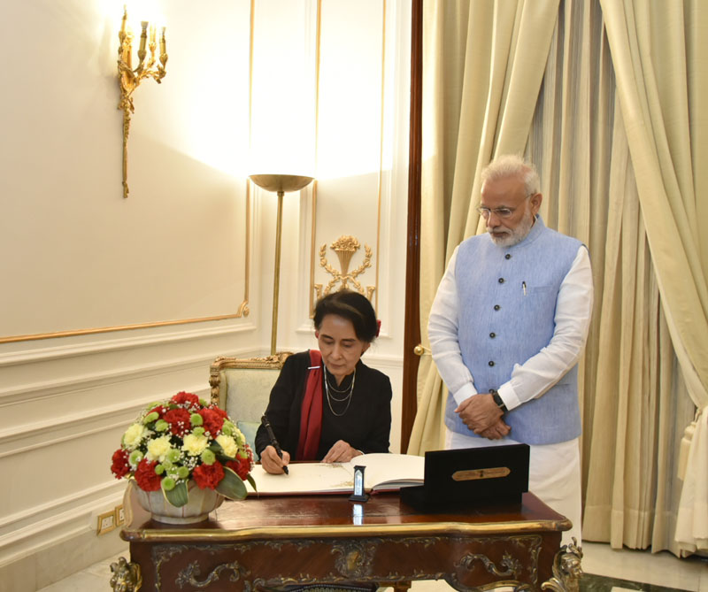 The State Counsellor of Myanmar, Ms. Aung San Suu Kyi signing the visitors book, at Hyderabad House, in New Delhi on October 19, 2016.