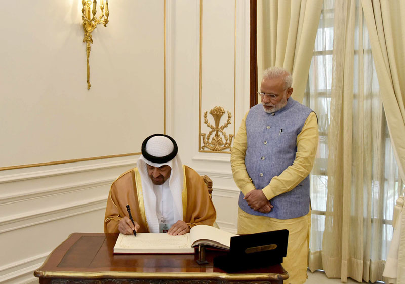 The Crown Prince of Abu Dhabi, Deputy Supreme Commander of U.A.E. Armed Forces, General Sheikh Mohammed Bin Zayed Al Nahyan signing the visitors' book, at Hyderabad House, in New Delhi on January 25, 2017. 