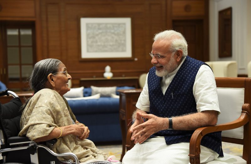 Smt. Sharbati Devi, a 103 year old widow ties a Rakhi on PM