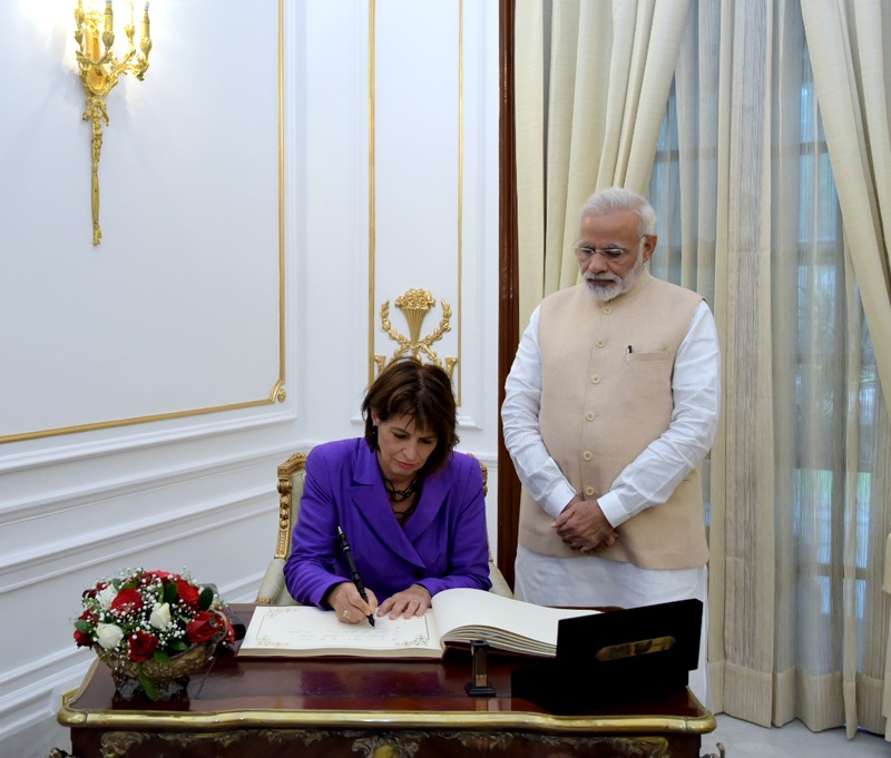The President of Swiss Confederation, Mrs. Doris Leuthard signing the visitors’ book, at Hyderabad House, in New Delhi on August 31, 2017.