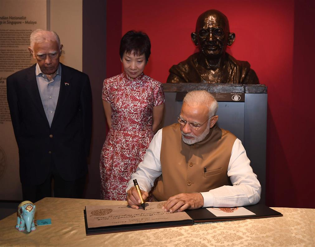 The Prime Minister, Shri Narendra Modi signing the visitors’ book, during his visit to the Indian Heritage Centre, in Singapore on June 02, 2018.