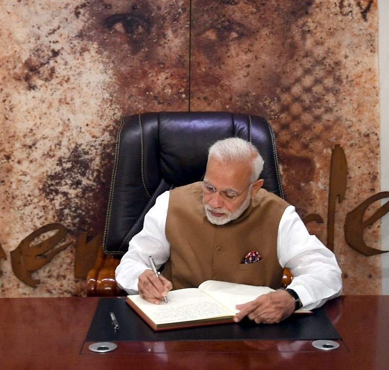 The Prime Minister, Shri Narendra Modi signing the visitor's book, during his visit to the Kigali Genocide Memorial Centre, in Rwanda on July 24, 2018.