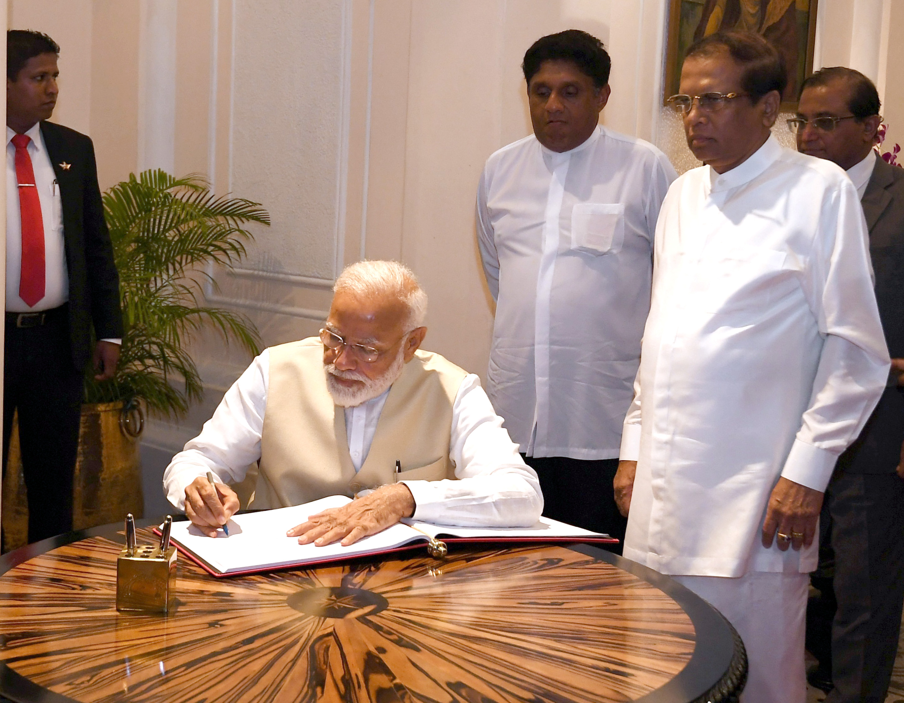 The Prime Minister, Shri Narendra Modi signing the visitors book, in Colombo, Sri Lanka on June 09, 2019.
	The President of the Democratic Socialist Republic of Sri Lanka, Mr. Maithripala Sirisena is also seen.