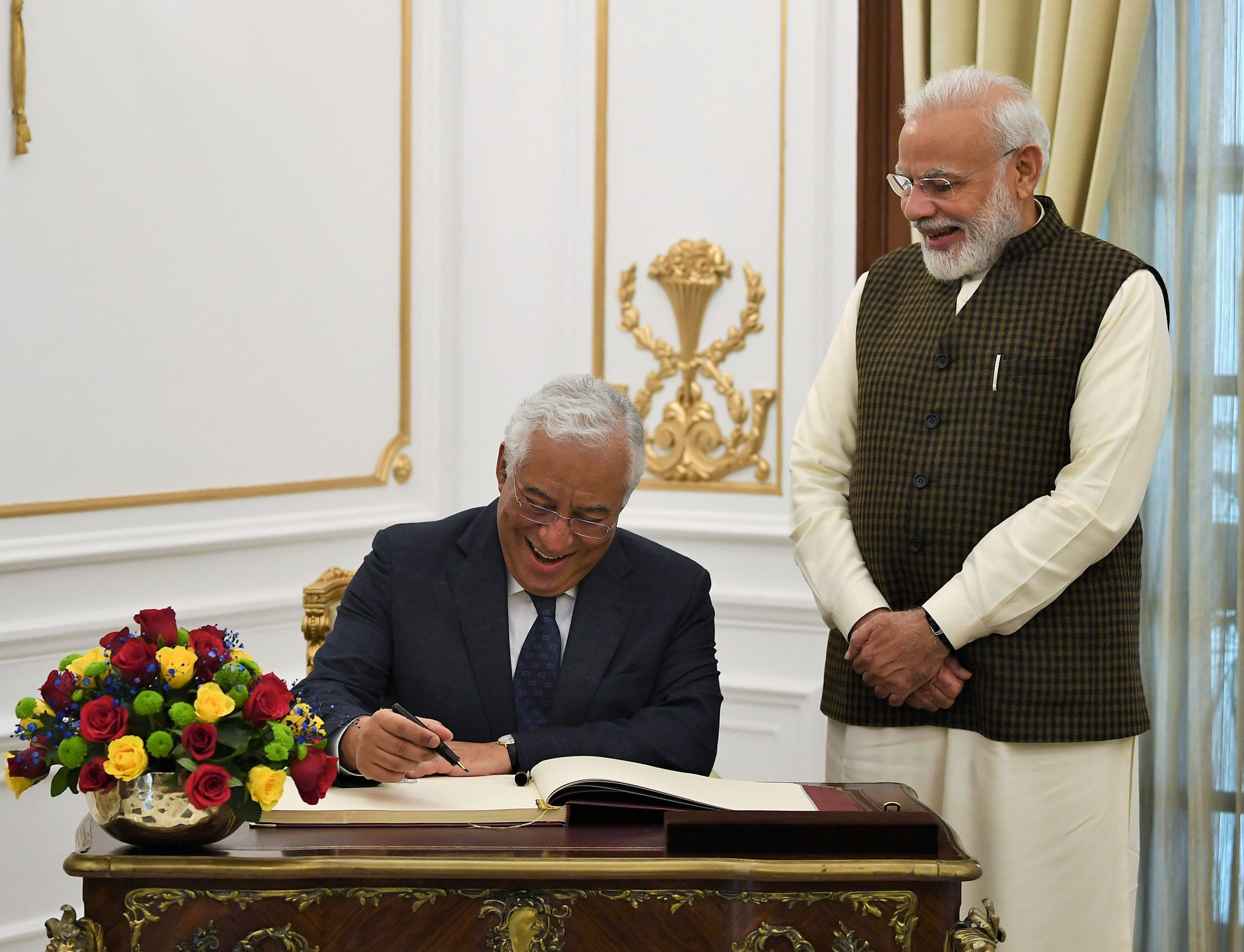 The Prime Minister of Portugal, Mr. Antonio Costa signing the visitors’ book, at Hyderabad House, in New Delhi on December 19, 2019. The Prime Minister, Shri Narendra Modi is also seen.