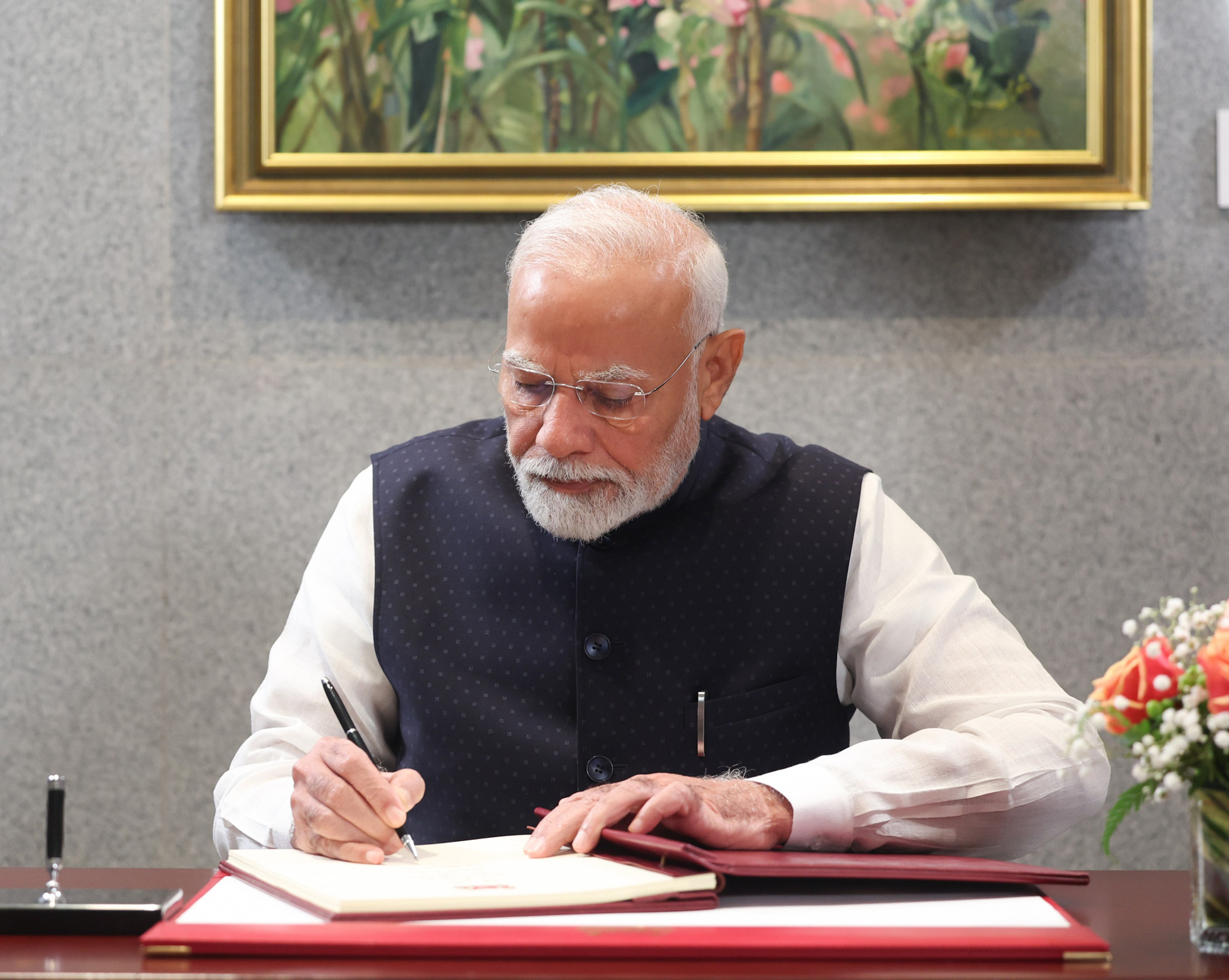 PM signing of Visitors Book, during the Ceremonial Welcome, in Singapore on September 05, 2024.