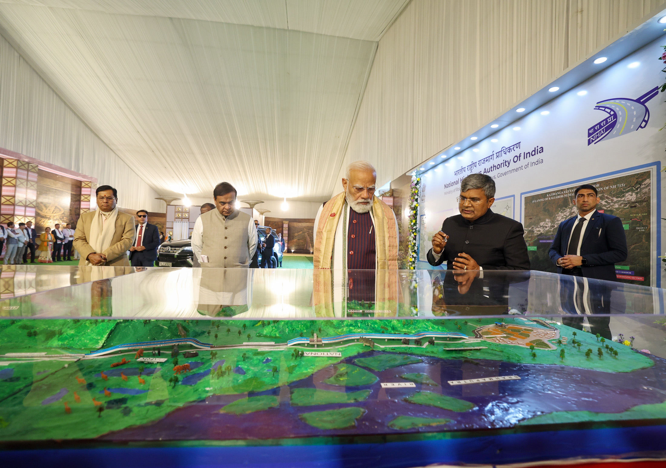 PM reviews the model of Kaziranga Elevated Corridor, in Assam on January 18, 2026.